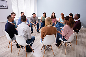 Group of people sitting in a circle