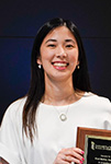 Vicki Bulkin headshot while holding a preceptor of the year award.