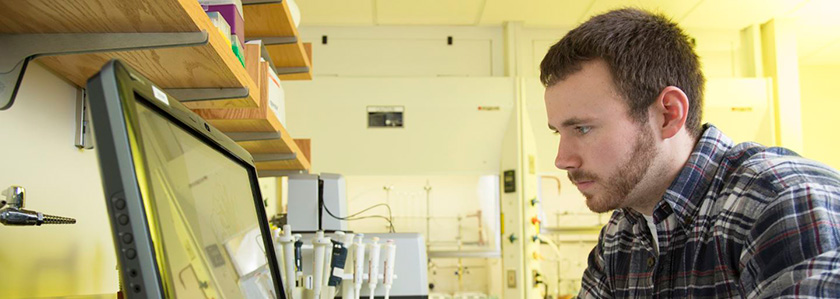 A student works on a computer.