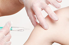 Vaccine being injected into arm.