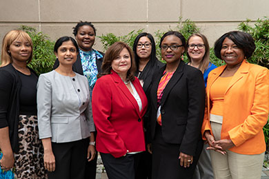 Faculty and staff from the Center for Innovative Pharmacy Solutions pose together for a group photo.