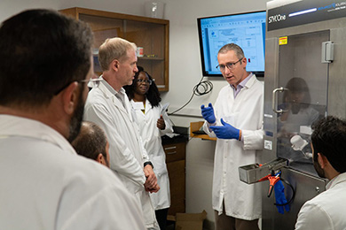 An instructor leads a short course demonstration in a lab.