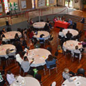 Participants at the Making Learning Health Care Communities More Patient-Centered conference listen to conference speaker.